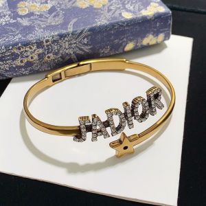 J'Adior Hinge Bangle Metal with J'Adior Signature Embellished Crystals and Star Charm Gold